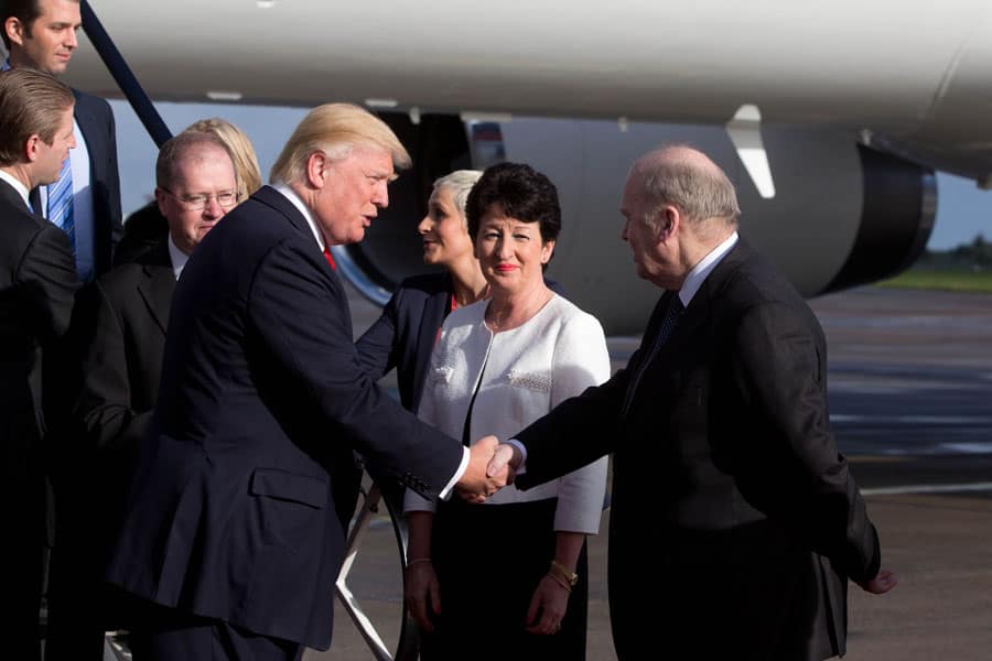 Donald Trump is greeted by Rose Hynes, Shannon Airport and Finance Minister Michael Noonan after landing.