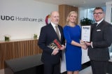 Barry O'Conner and Jackie Gilmore, MERC Partners, presenting Liam FitzGerald, UDG Healthcare with the Business Person of the Month Award.