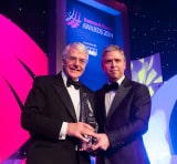 Sir John Major accepting his award for Outstanding Contribution to Ireland from Ian Hyland, Business & Finance