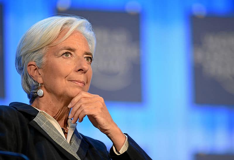 Christine Lagarde, President of the European Central Bank (ECB), thoughtfully considering the current state of the global markets.
