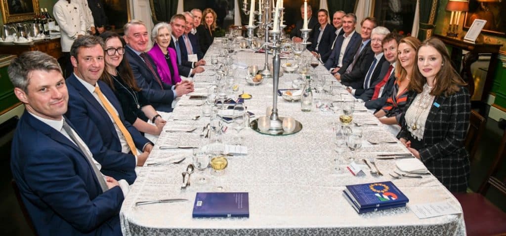 Business leaders at a dinner table