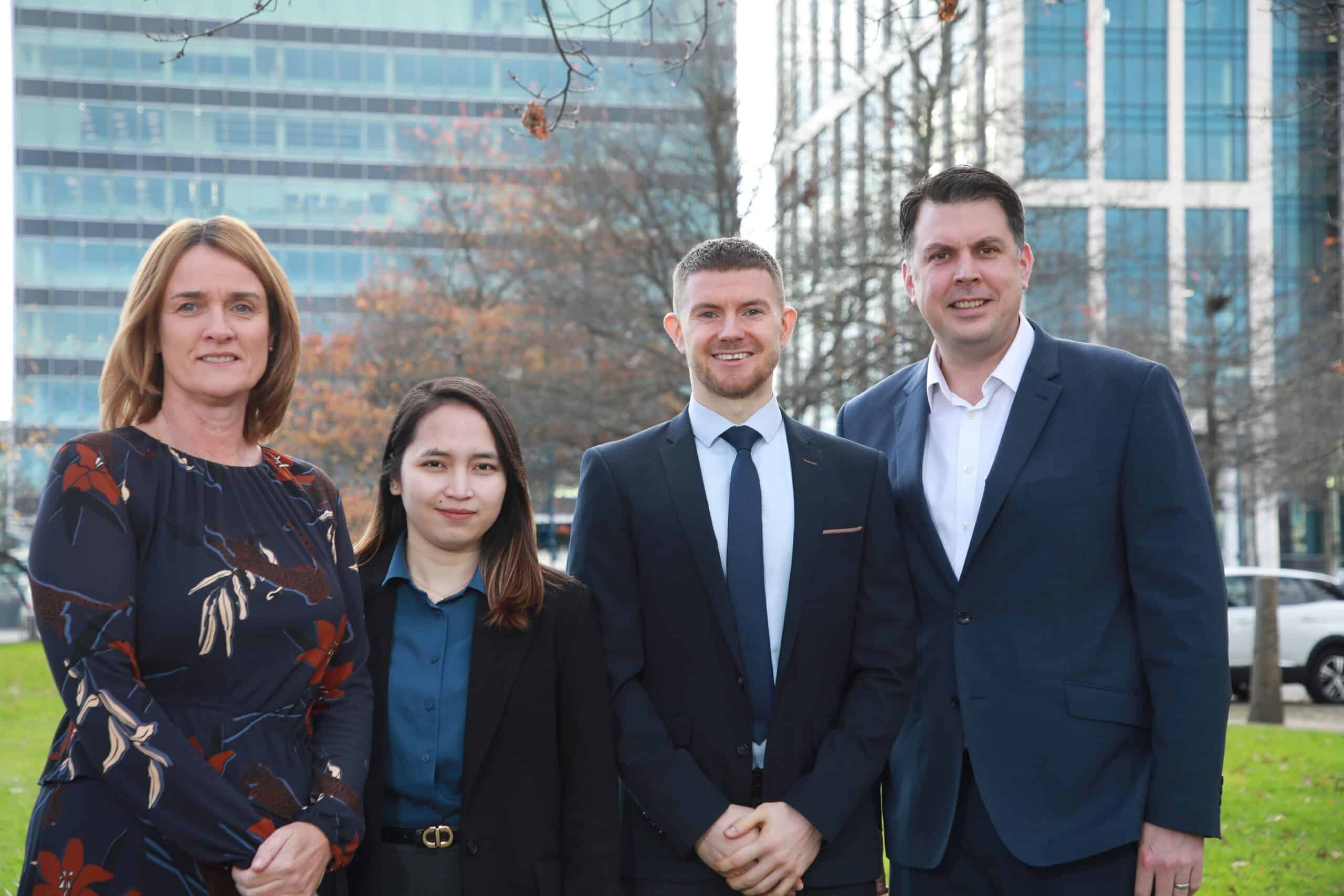 A photo of Rocel Asuncion and Tiarnan O’Brien smiling because they are appointed to the accountancy and advisory firm from Belfast, Baker Tilly Mooney Moore